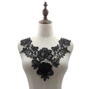 Elegant black water-soluble lace floral collar appliqué detail on a tailor's mannequin