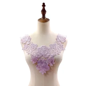 Detailed macro view of lavender rose embroidery water-soluble lace collar on mannequin