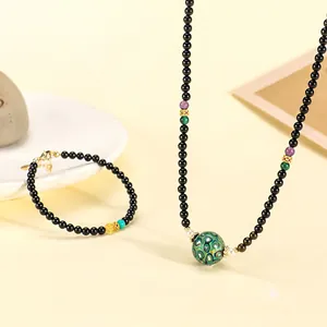 Handmade black agate bead necklace and bracelet set with green lacquer pearl detail