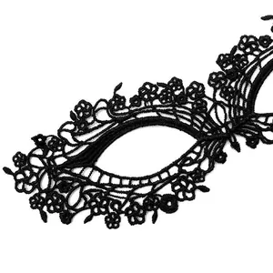 Detailed view of the intricate floral patterns on a black water-soluble lace eye mask