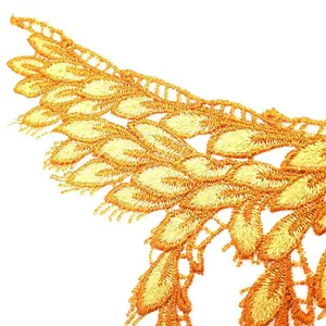 Close-up of yellow embroidered lace collar patch with hollow detail