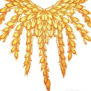Close-up of golden water-soluble lace collar applique with hollow embroidery