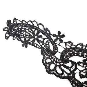 Close-up macro view showing the intricate texture of black water-soluble embroidery lace.