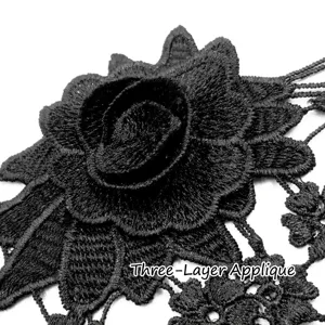 Detailed close-up of black three-layered water-soluble lace floral embroidery trim