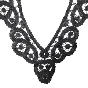 Close-up detail of black water-soluble lace embroidery collar with 3D hollow design