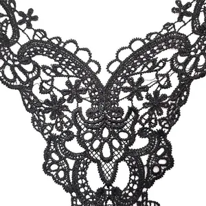 Macro detail of black water-soluble lace embroidery with intricate floral patterns