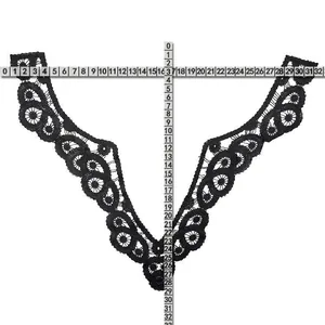 Detailed macro shot of black embroidered water-soluble lace collar with measurement rulers.