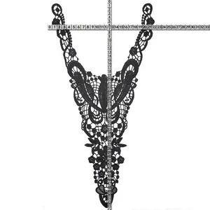 Detail view of black embroidered water-soluble lace collar with measurement rulers.