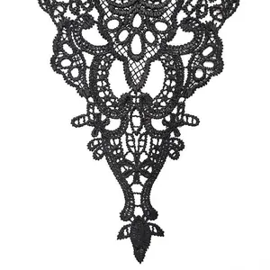 Detailed view of intricate black water-soluble lace embroidery collar applique design