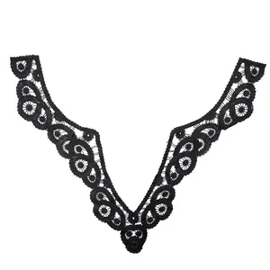 Detailed view of black embroidered water-soluble lace floral neckline appliqué