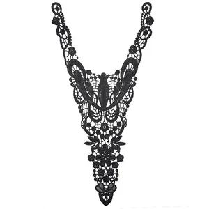 Close-up detail of black embroidered water-soluble lace cutout collar applique decoration