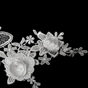 Close-up of white 3D water-soluble floral lace embroidery applique for DIY projects