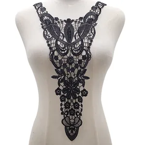 Close-up of elegant black lace embroidery neckline applique patch on mannequin display.