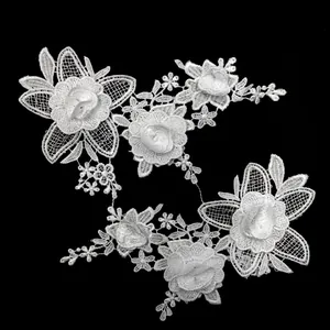 Close-up of white water-soluble lace embroidery with stereoscopic hollow flower pattern