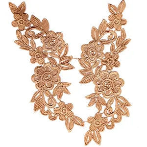 Close-up detail of golden bronze 3D floral water-soluble lace embroidery applique trim