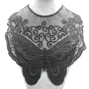 Detailed macro view of black butterfly embroidered water-soluble lace collar on mannequin bust