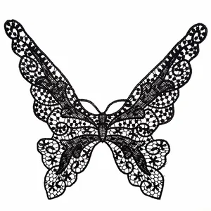 Close-up of black water-soluble lace butterfly applique with intricate hollow embroidery