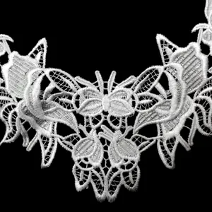 Detailed macro view of intricate white embroidered water-soluble lace collar DIY accessory