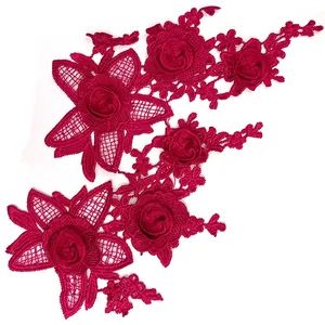 Detailed macro view of 3D fuchsia floral lace embroidery applique for DIY sewing crafts