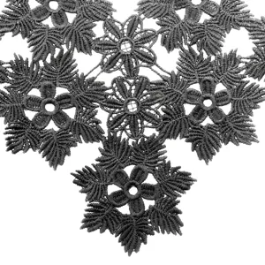 Detailed close-up showing the intricate black 3D hollow water-soluble floral embroidery lace