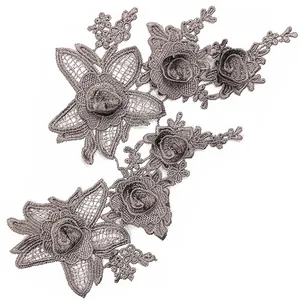 Detailed close-up of grey 3D water-soluble lace floral embroidery patches for DIY sewing