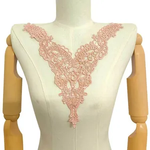Detailed view of pink water-soluble lace floral applique collar on mannequin