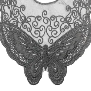 Detailed macro view of an intricate butterfly embroidered water-soluble lace neck patch
