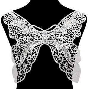 Detailed macro view of white butterfly-shaped water-soluble lace embroidery collar patch