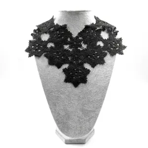 Detailed view of black water-soluble lace embroidered floral pattern fake collar