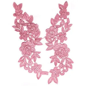 Detailed macro view of pink water-soluble floral lace embroidery applique for DIY sewing