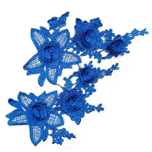 Detailed macro view of royal blue floral water-soluble lace embroidery patch