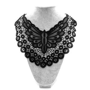 Close-up of black butterfly embroidered water-soluble lace collar detail