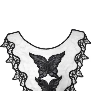 Detailed texture of black butterfly embroidery on water-soluble lace collar applique