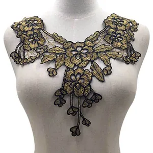 Detailed macro shot of black and gold water soluble lace floral collar appliqué on mannequin