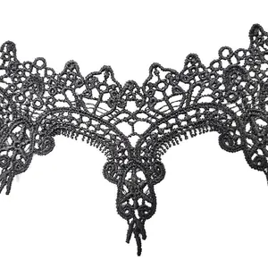 Close-up detail showing intricate pattern of black water-soluble embroidered lace collar patch