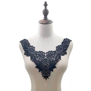 Detailed view of elegant black lace embroidery neckline applique on mannequin.