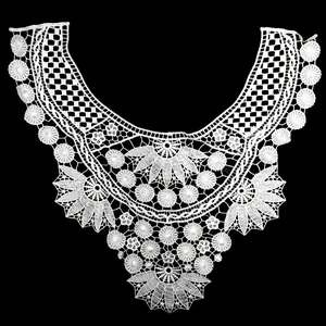 Detailed view of white water-soluble lace embroidered collar with hollow pattern
