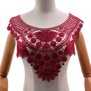 Close-up of an intricate wine red water-soluble lace collar with floral embroidery detail