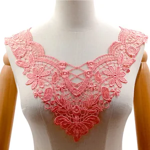 Detailed view of pink water-soluble lace floral embroidery collar on a mannequin