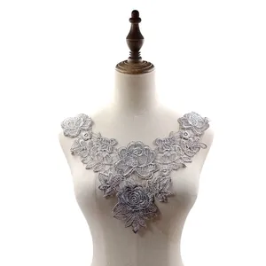 Detailed view of silver 3D floral water-soluble lace collar applique on mannequin