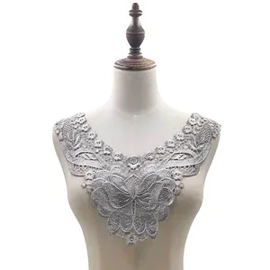 Detailed view of silver water-soluble lace collar with 3D floral and butterfly embroidery.