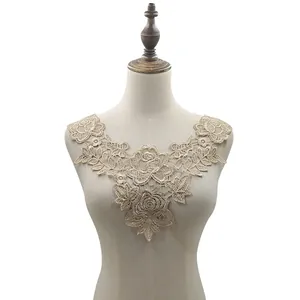Detailed view of elegant rose embroidered water-soluble lace collar on a dress form