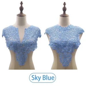 Macro detail of sky blue water-soluble lace collar featuring delicate embroidery