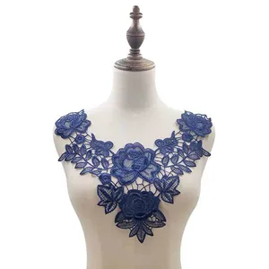 Detailed view of navy blue floral lace embroidery collar on a professional mannequin torso.