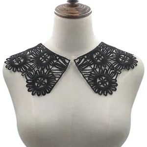 Detailed macro view of black water-soluble lace collar with 3D hollow floral embroidery