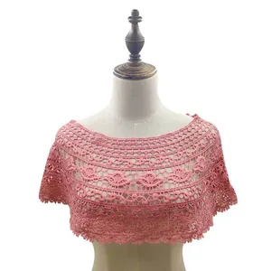 Detailed view of a stylish pink floral lace hollow-out shawl displayed on a mannequin