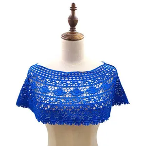 Detailed view of royal blue lace crochet hollowed-out capelet shrug on a dress form