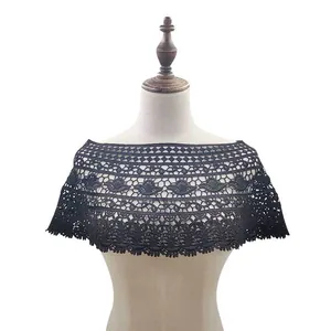 Detail showing intricate black lace crochet hollow-out shawl pattern on mannequin