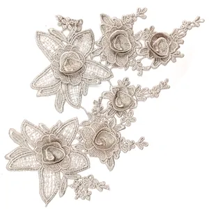 Detailed macro view of 3D beige floral embroidered water-soluble lace patches