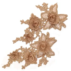 Detailed view of champagne gold 3D floral lace applique with intricate embroidery.